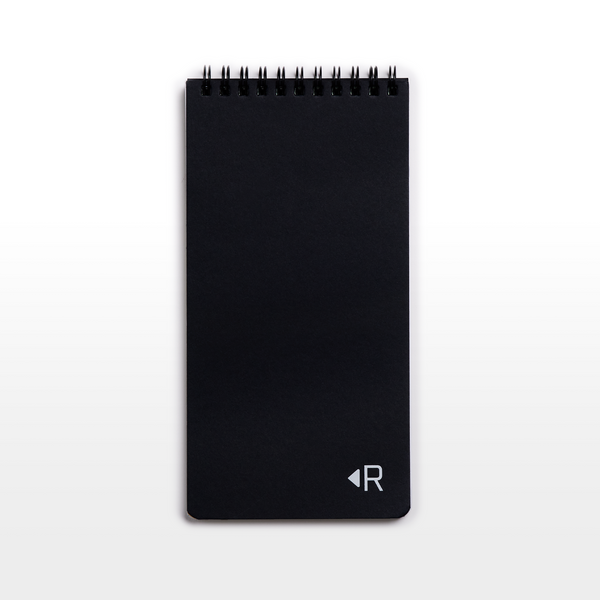 The Reporter by Resketch is a reporter-style notebook measuring 4x8 inches and is made from 100% reclaimed, reused, and upcycled paper. It has a black cover with a white resketch logo embossed on the cover with white foil and has a double-O black coil binding. It is eco-friendly and environmentally sustainable.