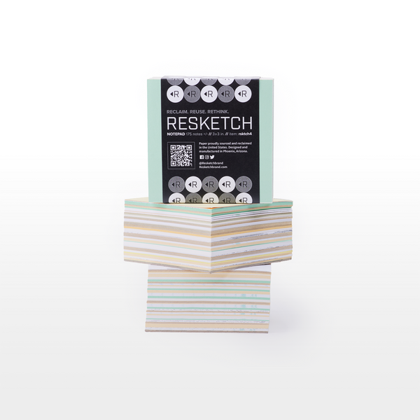 The Notepad is a 3x3 block of notes made from reclaimed, rescued, and upcycled paper. Black, white, and grey branded zero-waste packaging.